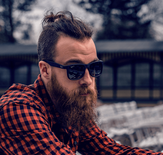 a young bearded man wearing sunglasses